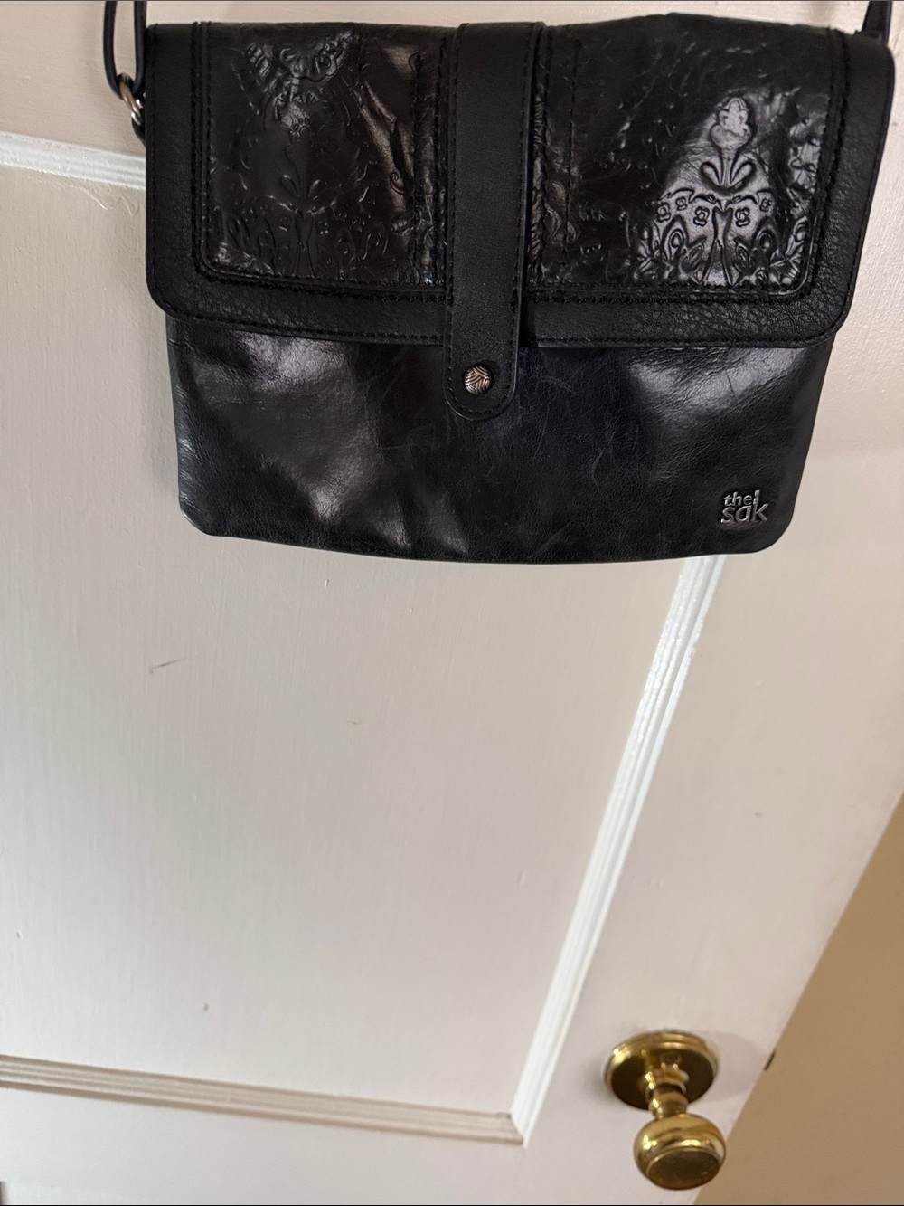 The Sak Black Embossed Flap Messenger Bag